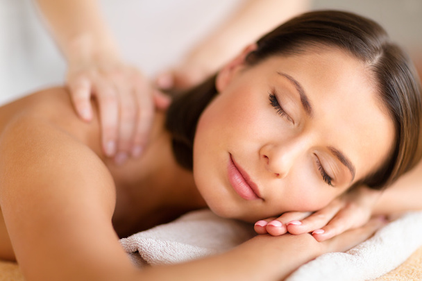 Beautiful woman in spa salon getting massage - Fotó, kép