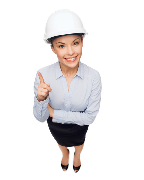 Businesswoman in white helmet with finger up - Фото, зображення