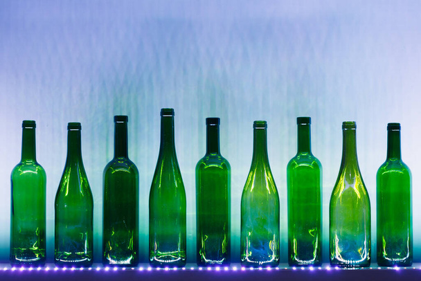 abstract empty wine bottles with blue led illumination - Photo, Image