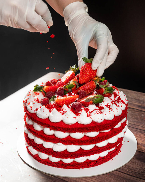 Tasty red strawberry chocolate cake, pouring ingredient - Photo, Image