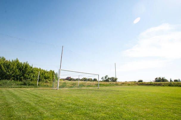 Football gate and football net. Soccer concept. Village stadium. - Zdjęcie, obraz
