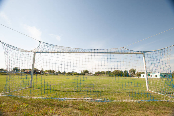 Football gate and football net. Soccer concept. Village stadium. - Photo, image