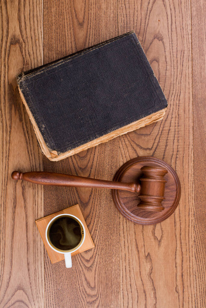 Judges hammer with old book and cup of coffee. - Photo, Image
