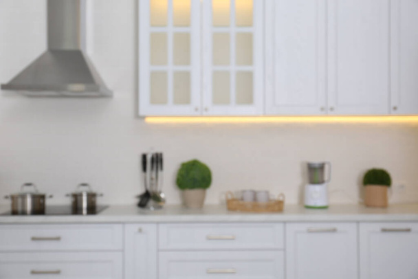 Blurred view of modern stylish kitchen interior - Фото, зображення