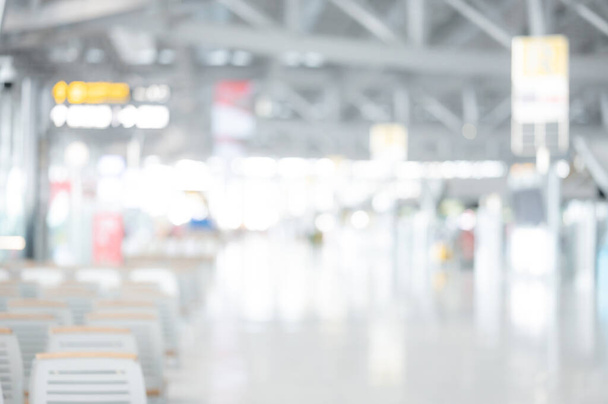 Abstract blur airport terminal. Blurred hall interior in transportation building. Defocused effect background or backdrop for travel industry concept. - Фото, изображение