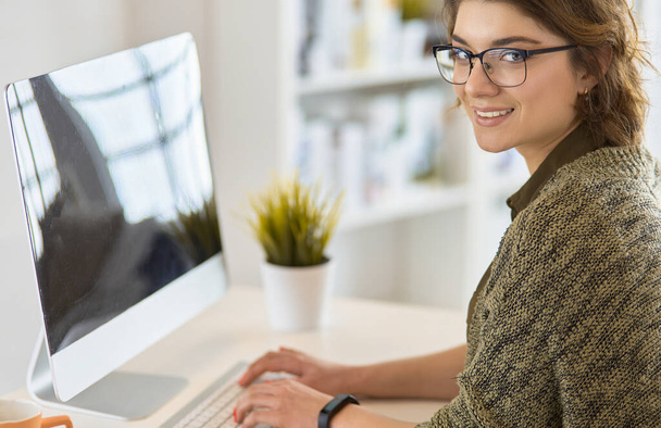 Closeup of businesswoman typing on laptop computer - 写真・画像