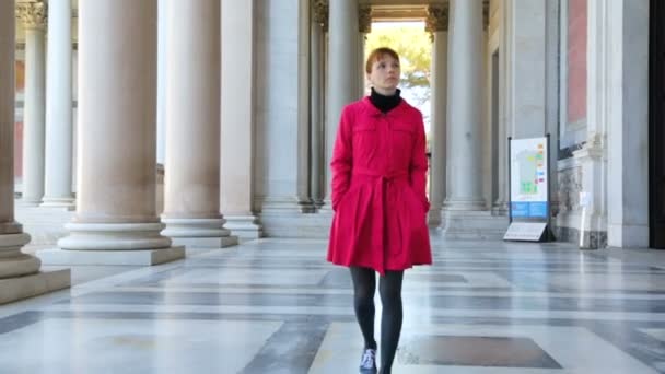 Woman walking along the columns in Basilica of Saint Paul - Footage, Video