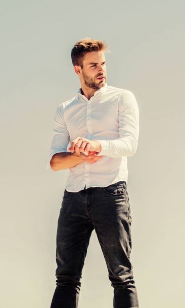 Young expertise. confident businessman. Handsome man fashion model. formal male fashion. modern lifestyle. success concept. Sky background. sexy macho man. male grooming. Bearded guy business style - 写真・画像
