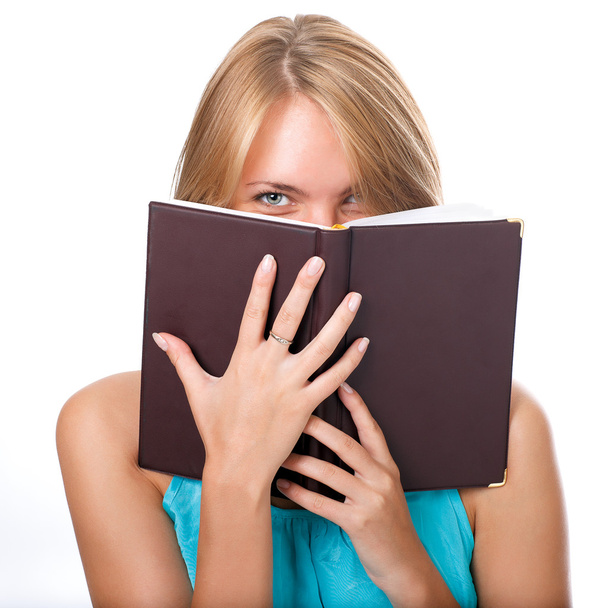 Close up of young woman reading book - Фото, изображение