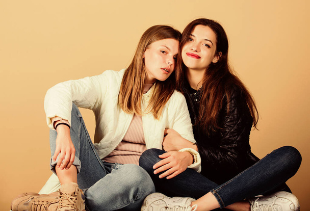 always together. happy women in spring jacket. warm clothing fashion. girls relax and embrace. seasonal shopping. beauty and fashion. female friendship in action. family values. they love each other - Foto, afbeelding