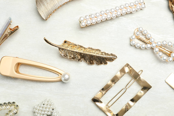 Beautiful different hair clips on white table, flat lay - Photo, image