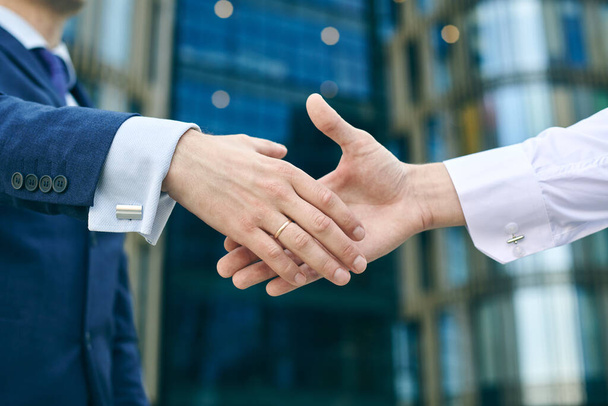 Start of business handshake outdoors. Partnership meeting concept. Successful businessmen handshaking after good deal. Congrats  - Φωτογραφία, εικόνα