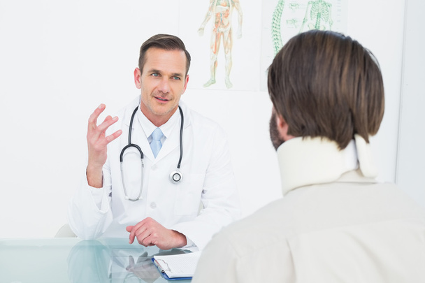 Doctor in communication with patient at medical office - Photo, image