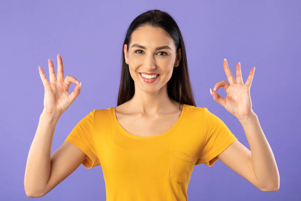 Happy young girl showing ok sign gesture - Photo, Image
