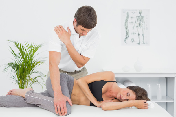 Male physiotherapist massaging woman's body - Фото, зображення