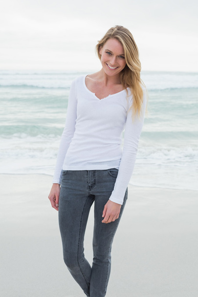 Portrait of a beautiful casual woman at beach - Photo, Image