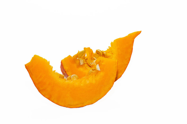 Ripe orange pumpkin and slices isolated on a white background. Slice of ripe orange pumpkin Isolated on a white background. - Foto, imagen