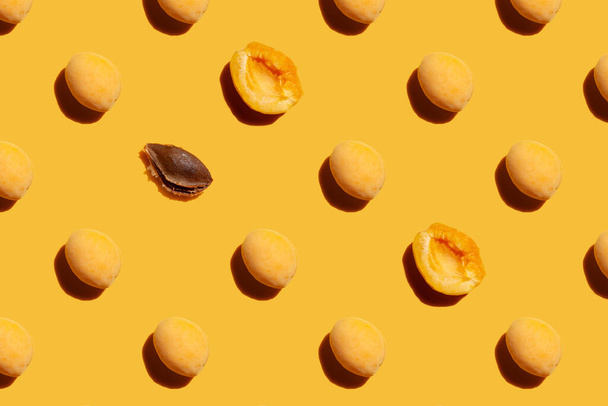 a lot of apricot on a yellow background - Fotoğraf, Görsel