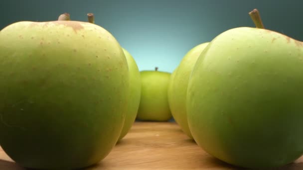 view between rows of green apples. super close up. - Filmati, video