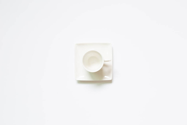 White coffee cup on white background. top view - Zdjęcie, obraz