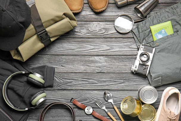 Set of traveler's accessories on wooden background - Фото, зображення