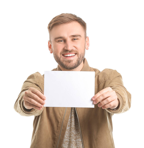Young man with blank card on white background - Photo, image