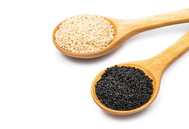 white and black sesame seeds with spoon isolated on white background - Photo, Image