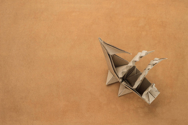 Origami paper sailboat mockup. Selective focus. Old vintage craft background - Photo, Image