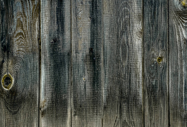 vertical lined wooden panels. Aged and shabby weather- beaten wood. Natural texture and wood background with space for text - Foto, imagen