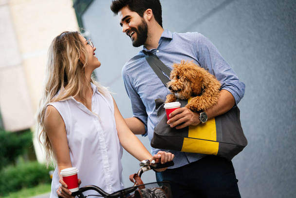 Summer, bikes, love, couple, relationship and dating concept. Couple with bicycles in the city - Фото, изображение