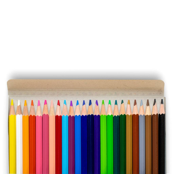 The colorful unused pencils in a cardboard box isolated on a white background - Φωτογραφία, εικόνα