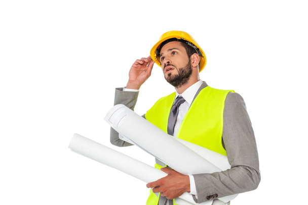 Engineer in suit holding hardhat and blueprints isolated on white - Fotó, kép