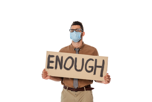 Teacher in eyeglasses and medical mask holding signboard with enough lettering isolated on white - Photo, Image