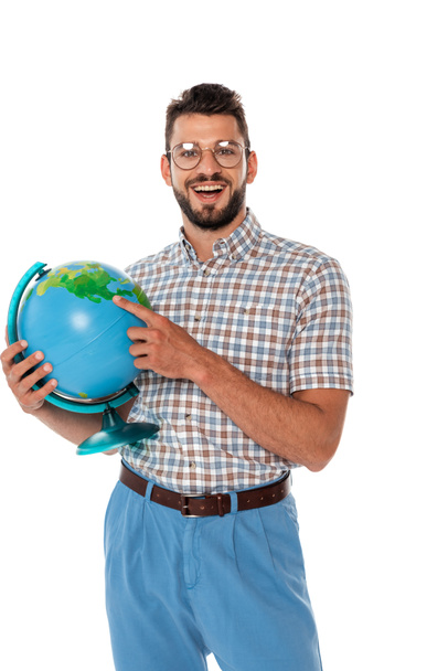 Happy nerd pointing with finger at globe isolated on white - Photo, Image
