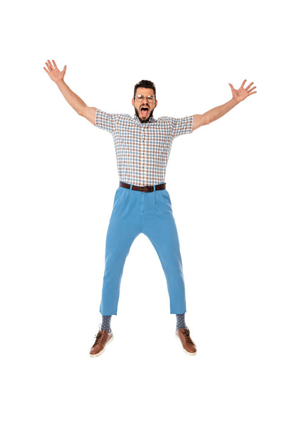 Excited nerd with raised hands looking at camera isolated on white - Foto, afbeelding