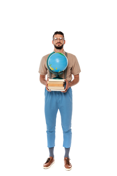 Handsome nerd holding books and globe and looking at camera on white background - Valokuva, kuva
