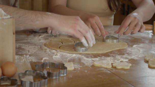 Closeup of hands that are cut out in cookie dough. - Footage, Video