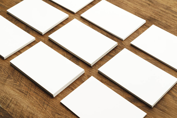 Blank businesscard stacks on rough wooden table - Foto, afbeelding