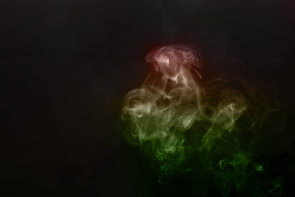 Figured smoke on a dark background. Abstract background, design element, for overlay on pictures. - Fotografie, Obrázek
