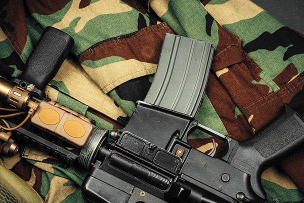 Khaki military uniform with ammunition close up - 写真・画像