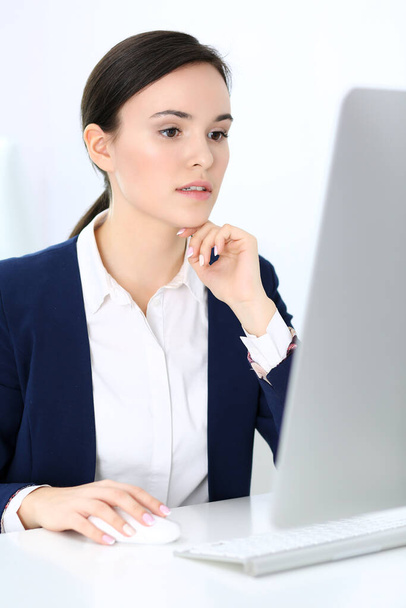 Business woman working with computer in office. Headshot of Lawyer or accountant at work while sitting at the desk - Φωτογραφία, εικόνα