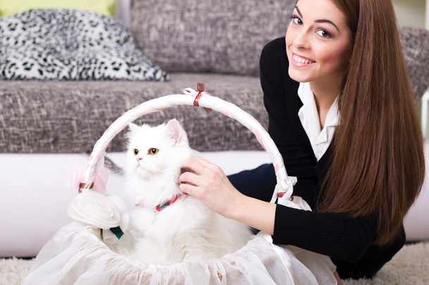 beautiful young woman and persian white cat at home - Fotoğraf, Görsel