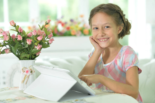 Portrait of  Beautiful little  girl with tablet pc - Zdjęcie, obraz