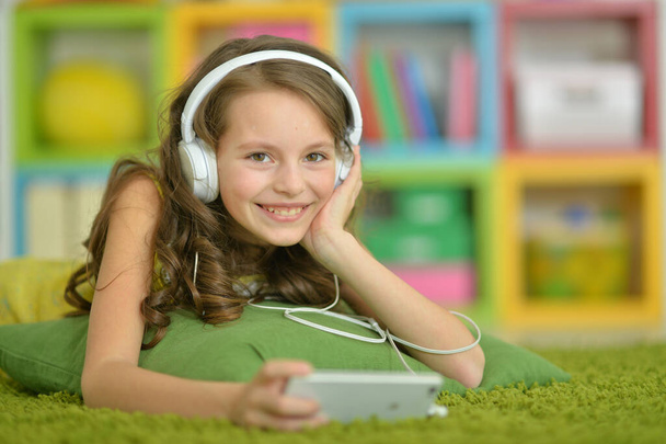 Cute little girl with headphones - Photo, Image