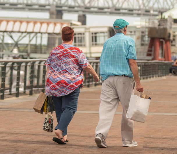 unknown senior couple is enjoying a day of shopping - Photo, Image