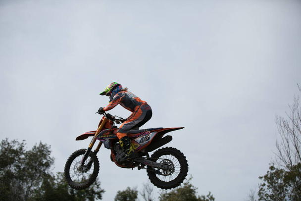 Orlando, Florida, USA - 03.09.2018: Motocross riders practice tricks and skills on their dirt bikes on a sunny day in central Florida. - 写真・画像