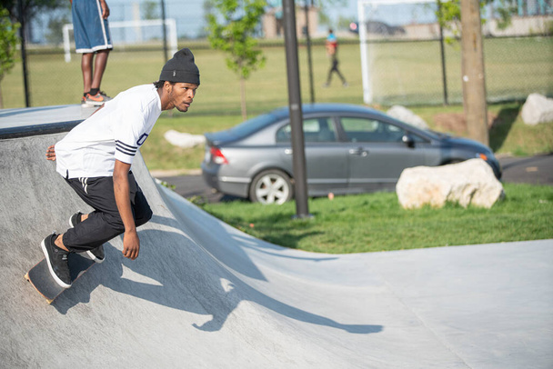 Detroit, Michigan, USA - 07.24.2019: Skaters practice tricks on their skateboards on a sunny day in Detroit - Fotografie, Obrázek