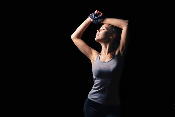 Sexy athletic fitness woman. Black background - Φωτογραφία, εικόνα