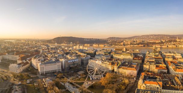 Panoramic Aerial drone shot of Erzsebet ter Square at dawn in budapet downtown in winter - Фото, изображение