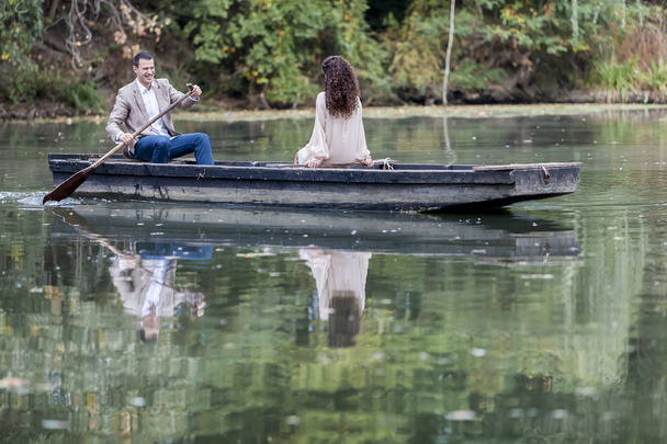Loving couple in the boat - Фото, изображение